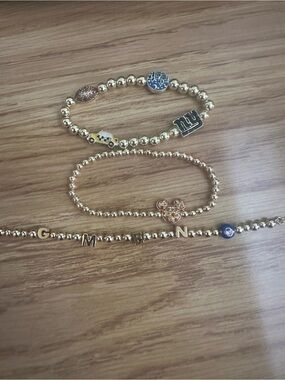 Gold Baublebar New York theme bracelet set